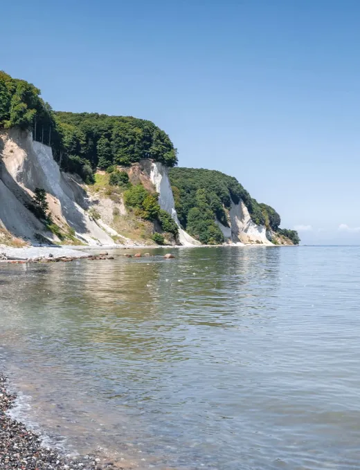 Cliffs of Rügen with calm sea and clear sky.